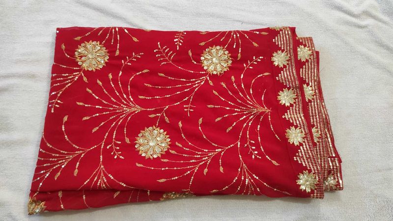 Radiant Red Saree with Intricate Gold Sequins