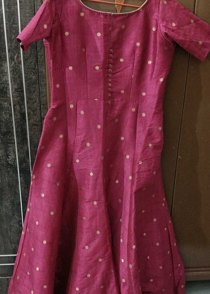 A Majenta Ethnic Gown...