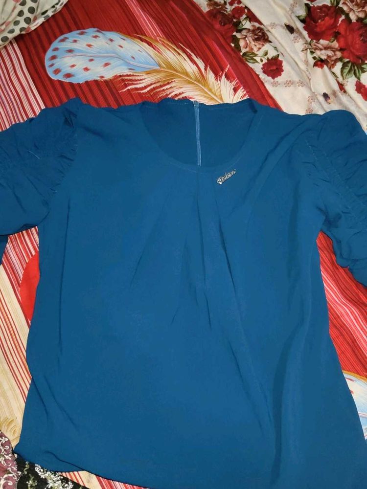 Elegant Blue Top with Detailed Sleeves