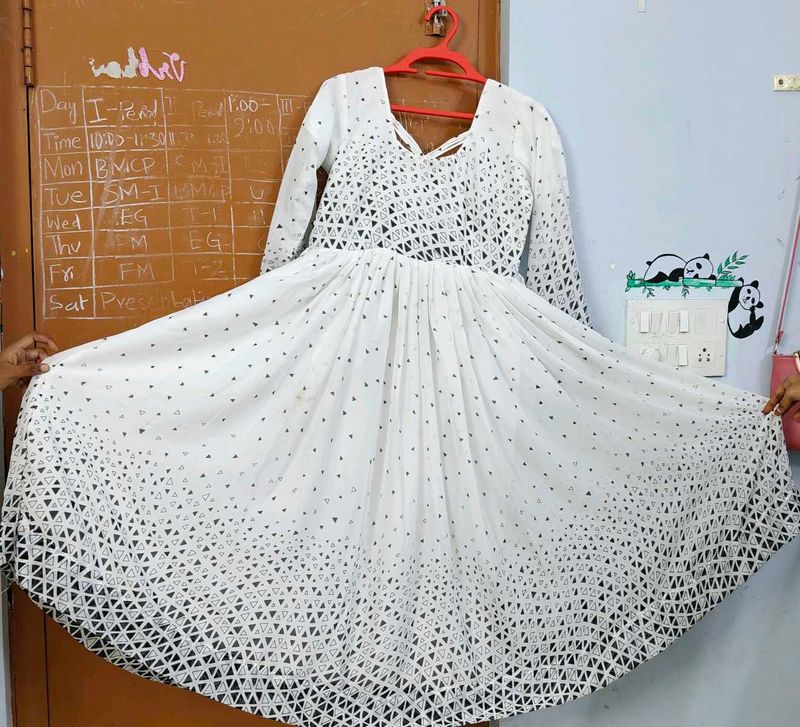 White frock with black dots design..