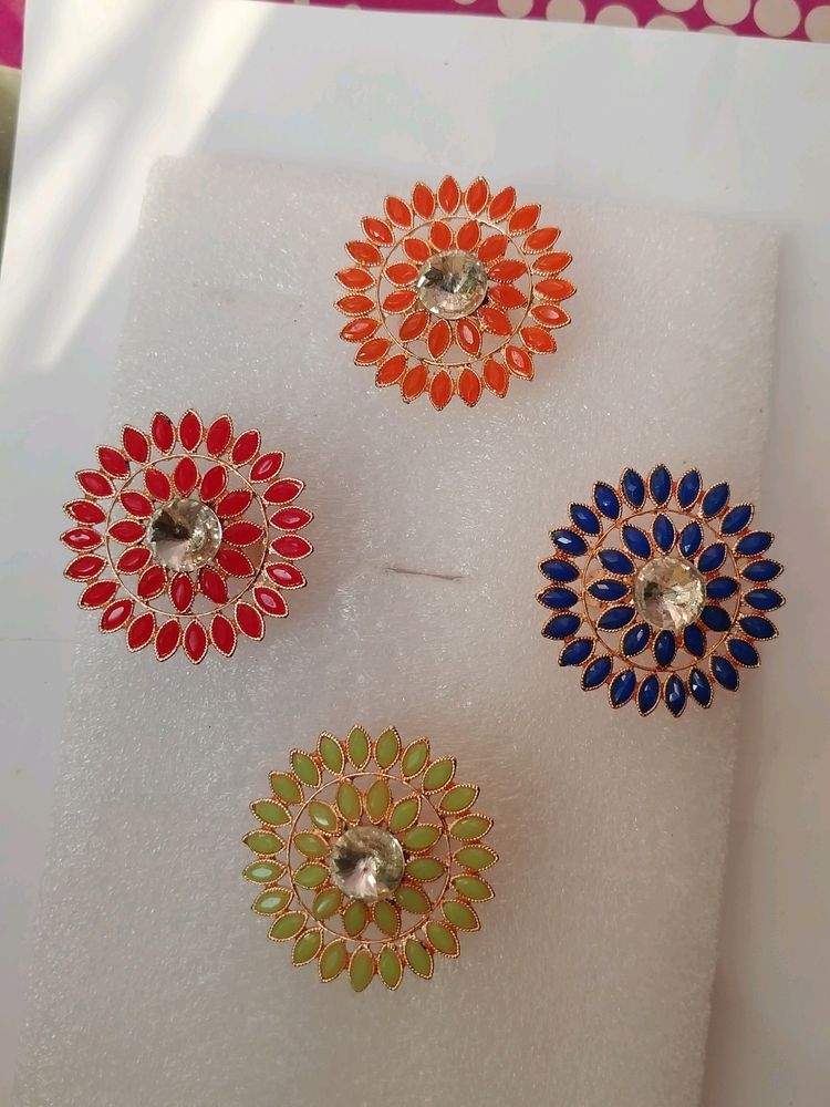 Red, Pista Green, Blue And Orange Four Colour Stone Rings Available.   99 Rs For 1 Piece.