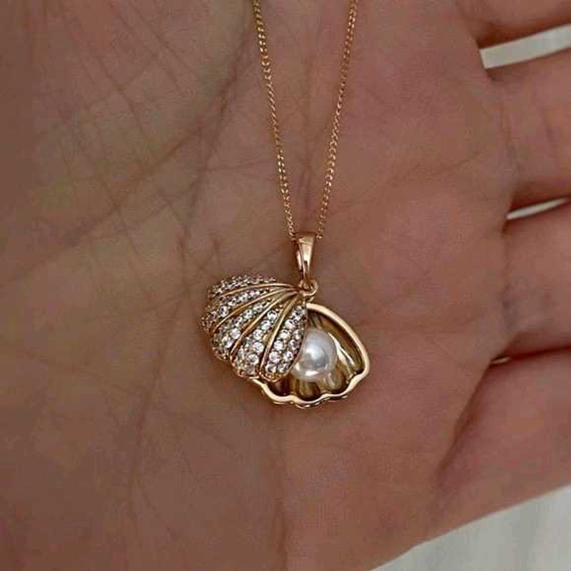 Beautiful stainless Steel golden shell necklace.