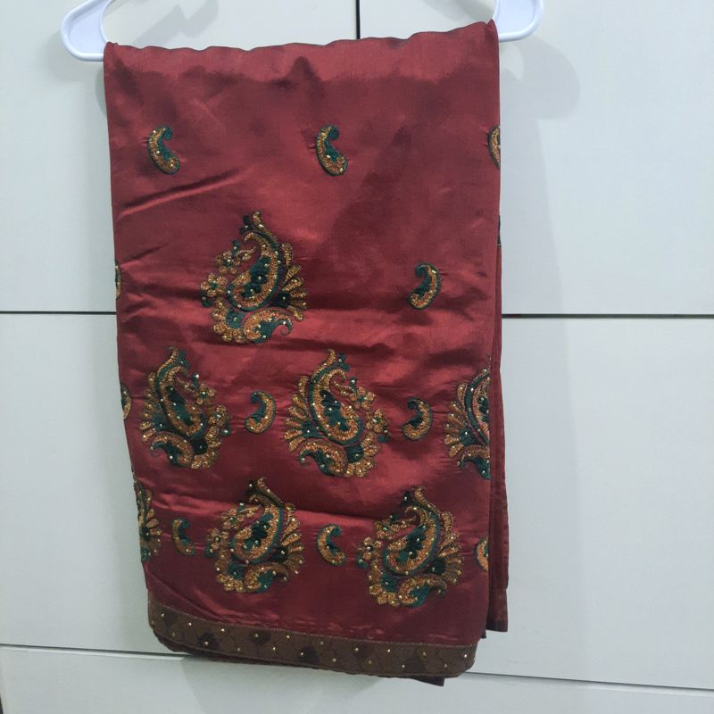 Maroon Silk Saree With Green And Golden Embroidery And Glitter Paint Work