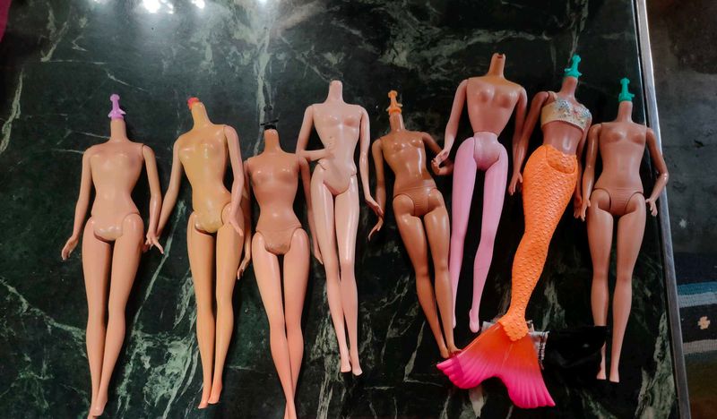 Lot of 8 Barbie Dolls
