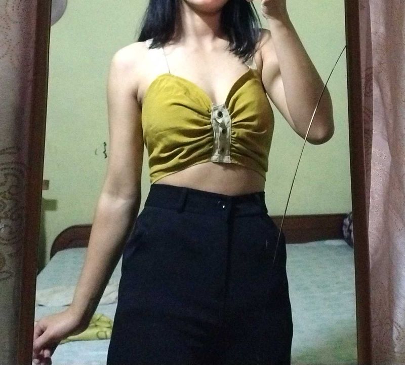 mustard yellow crop top .