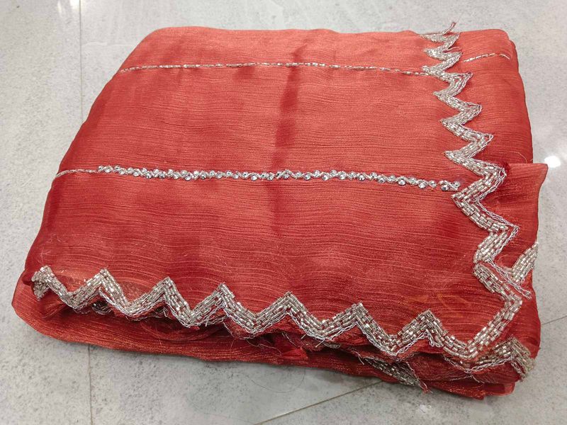 Elegant Red Saree with Silver Embellishments