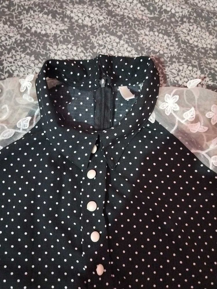 A Black Polyster Top With White Dots Nd Classic .
