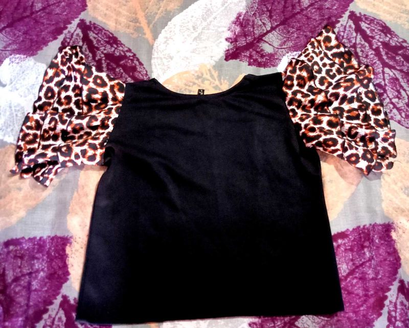 Animal print black ruffle sleeveless top