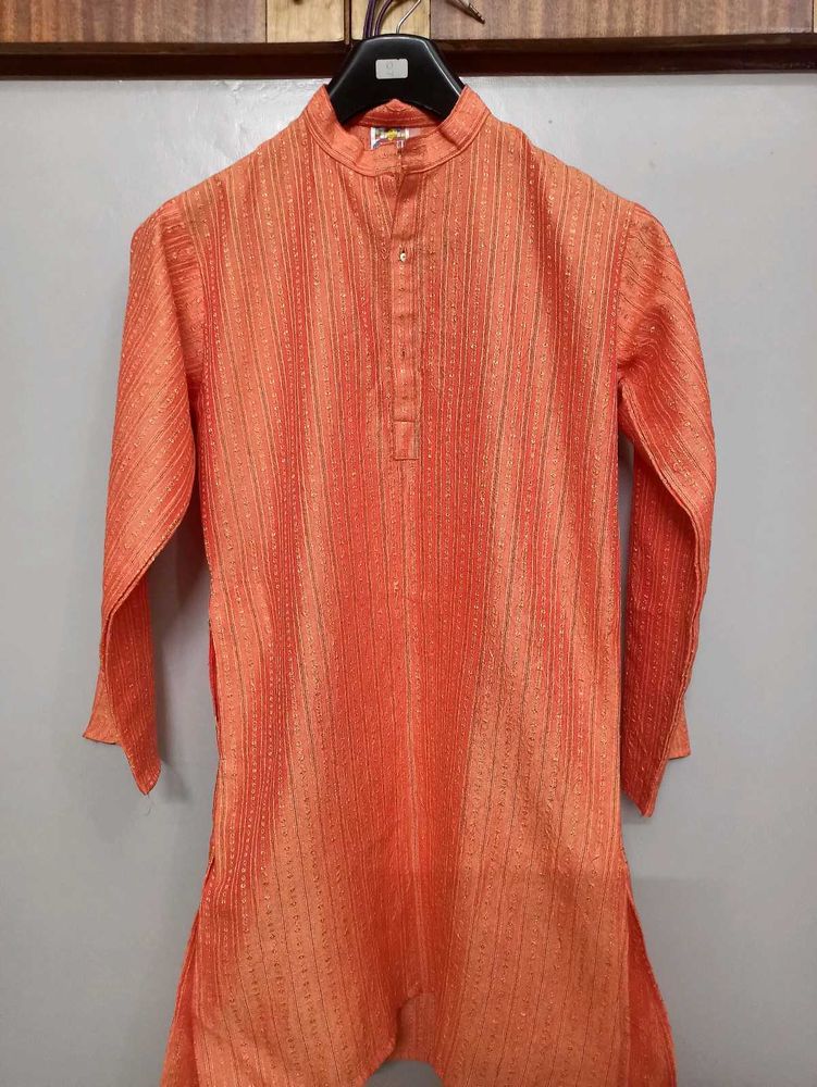 Orange Kurta With Silk Work On It.