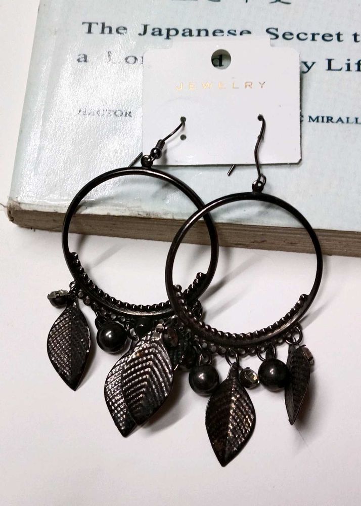 A Pair Of Black Hoop earrings