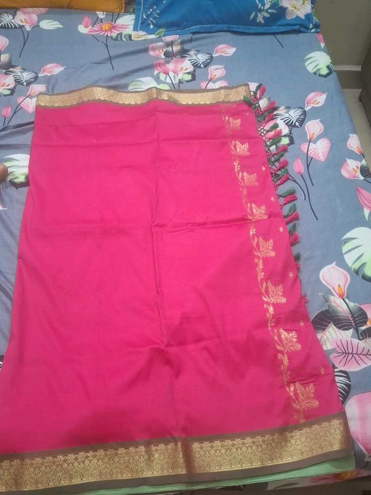 Elegant Pink Saree with Golden Details