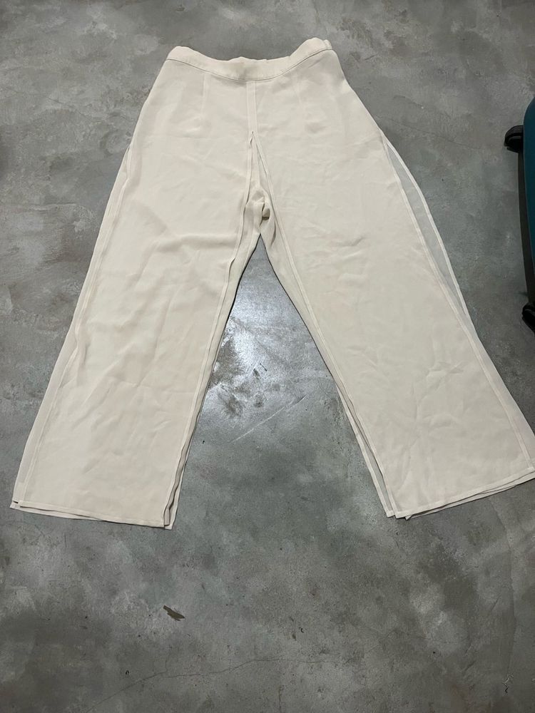 Beige Wide-Leg Sheer Overlay Trousers.