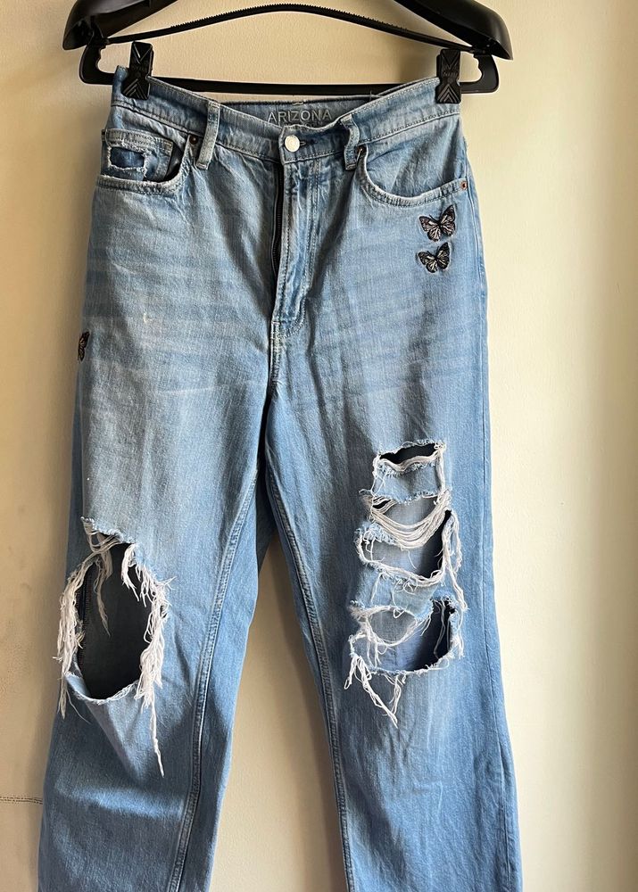 Ripped Denim Jeans with Butterfly Embroidery