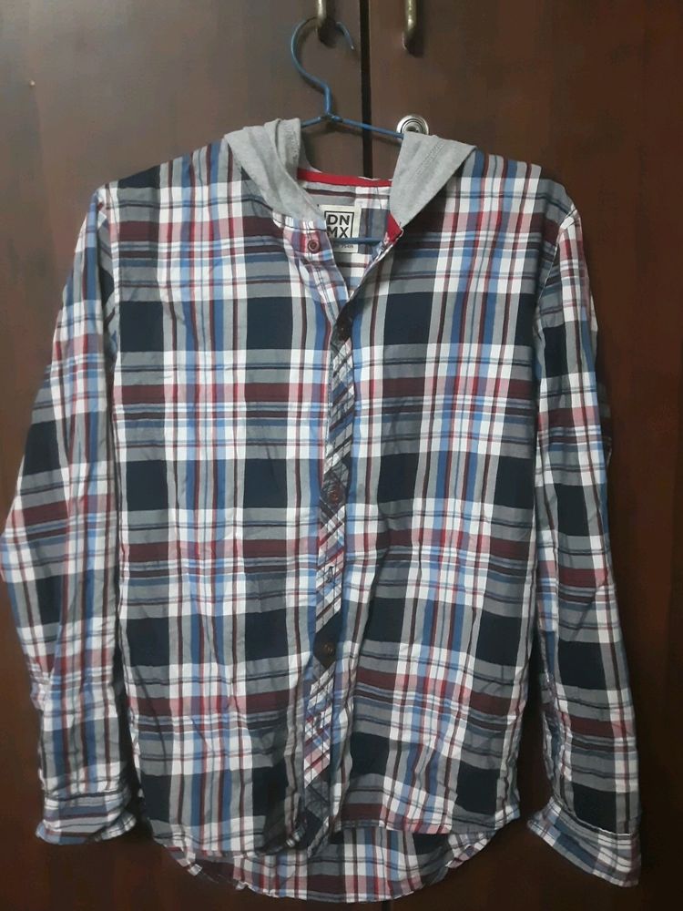 Stylish boys&#39; plaid shirt with an attached hoodie.