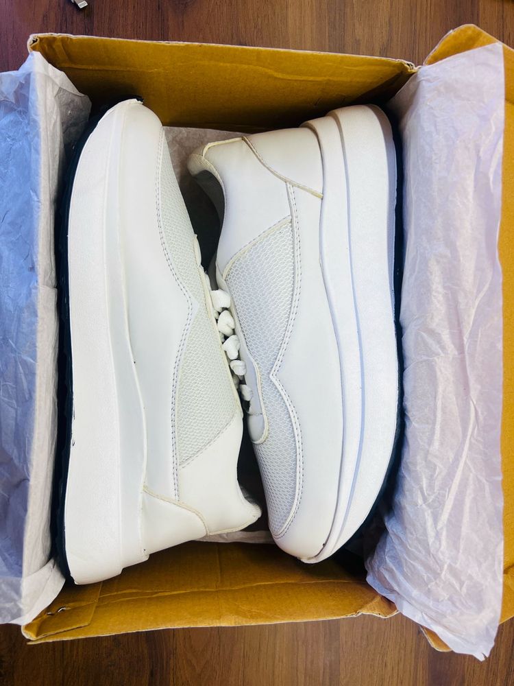 White sneakers branded new