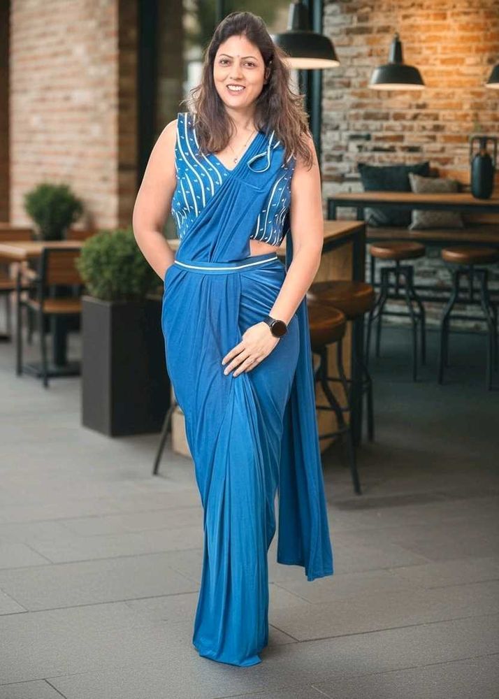 Elegant Blue Sleeveless Saree with stiched blouse.