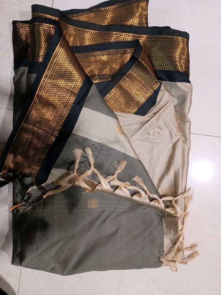 Beige Colour Saree With black &amp; Golden Border.