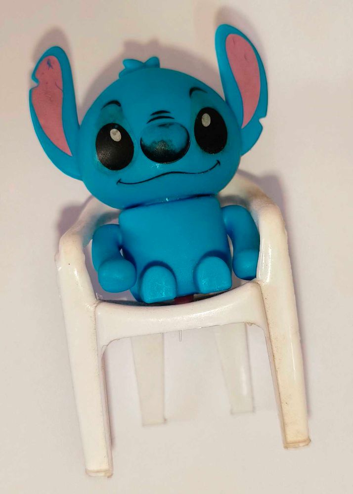 Stitch Figurine and white chair