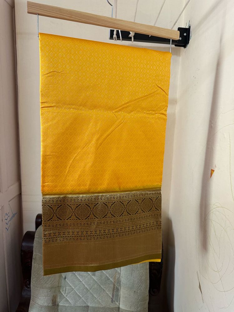 Elegant Yellow Art Silk Saree With A Classy Bangle