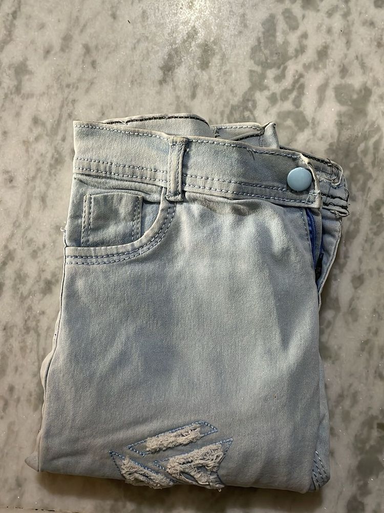 Ripped Light Wash Denim Jeans