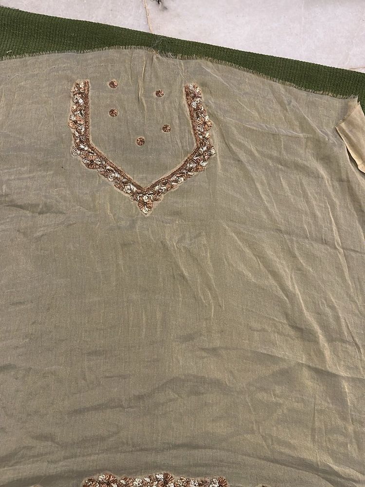 designer blouse piece in soft gold with hand work