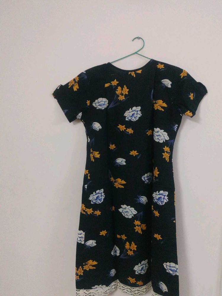 I am selling a black cotton mini dress.