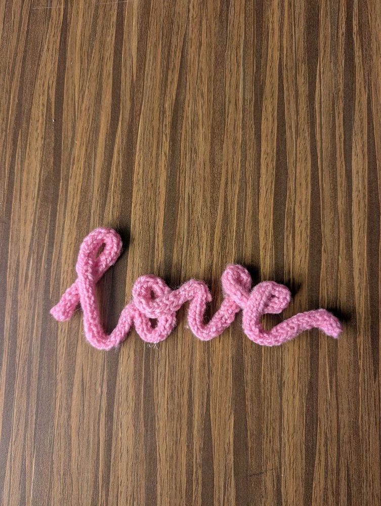 Pink Knitted &#39;Love&#39; Sign