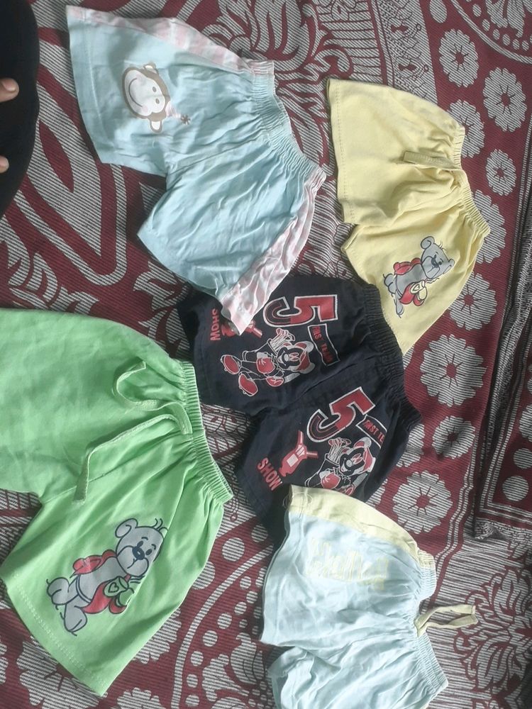 Combo Of Kids Shorts  Till 18 Months You Can Use  Only Green One Has Small  Stain  That To  Other Dress  Color  Sticked To This One  And  All  Elastics Are Good In  Condition Hardly Used  4 To 5Times