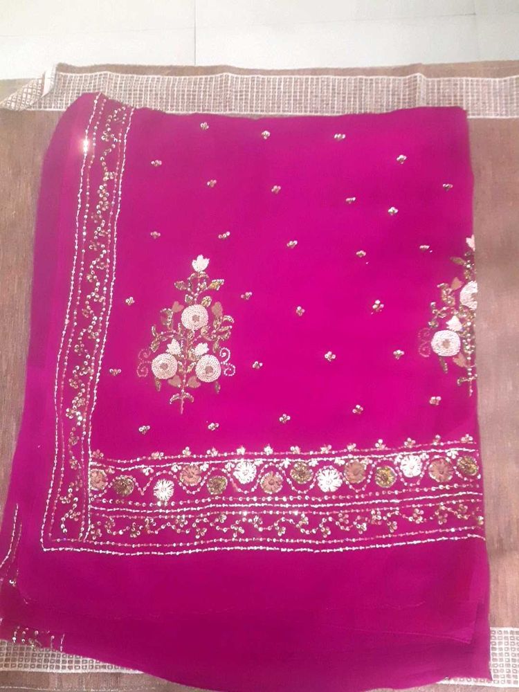 Ambroider saree with blouse.