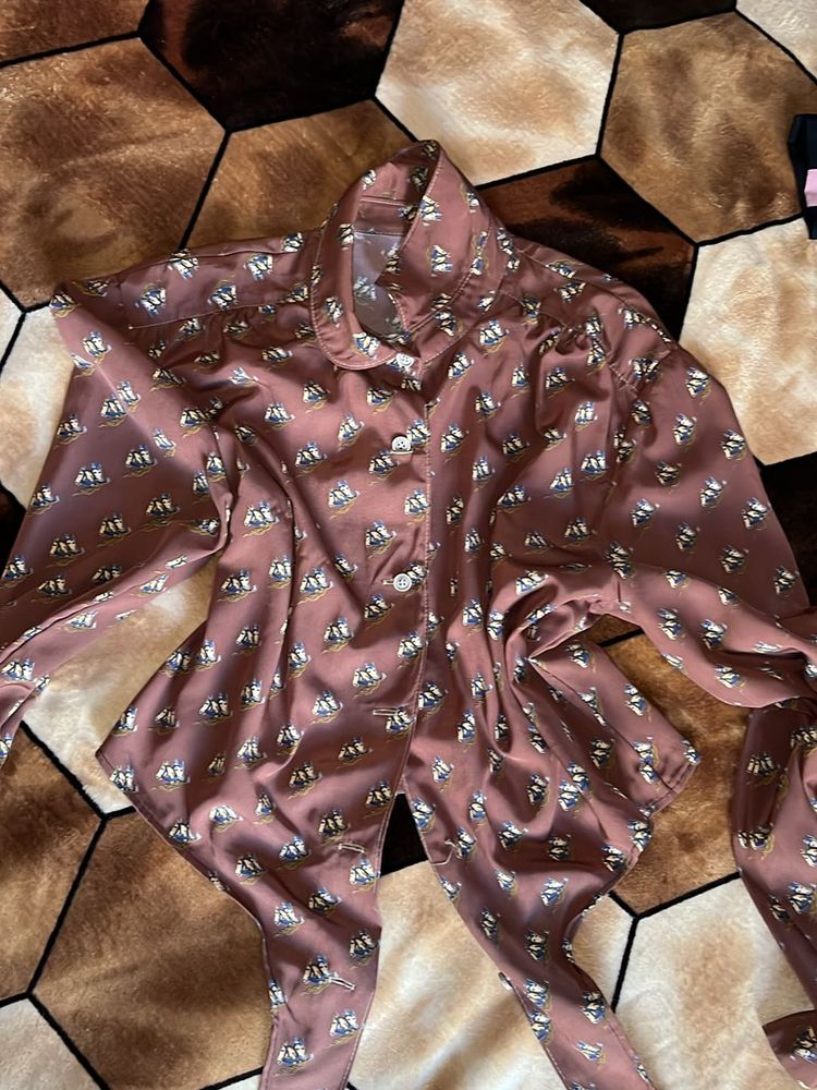 crazy button up top with a tying knot down