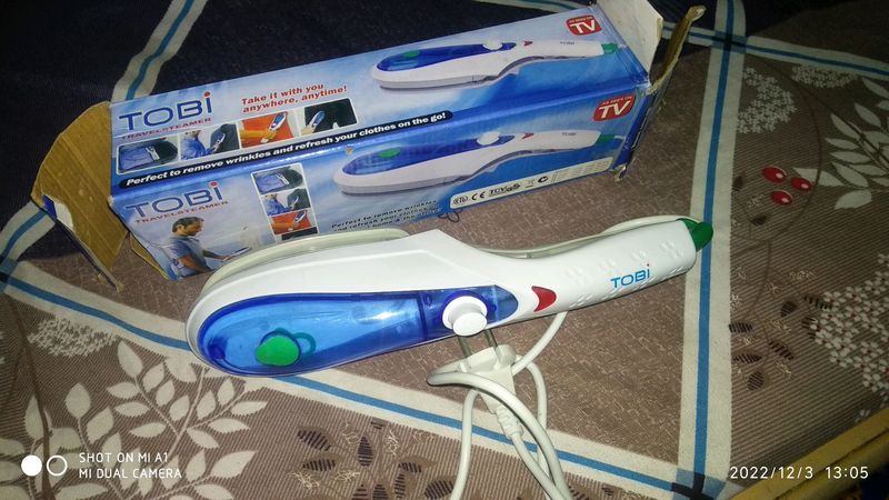 travel ironing press