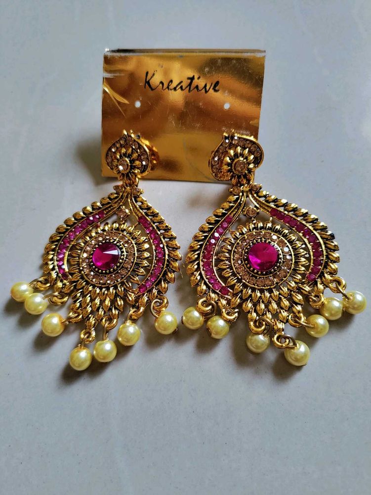 Statement earrings with pink stone and pearl