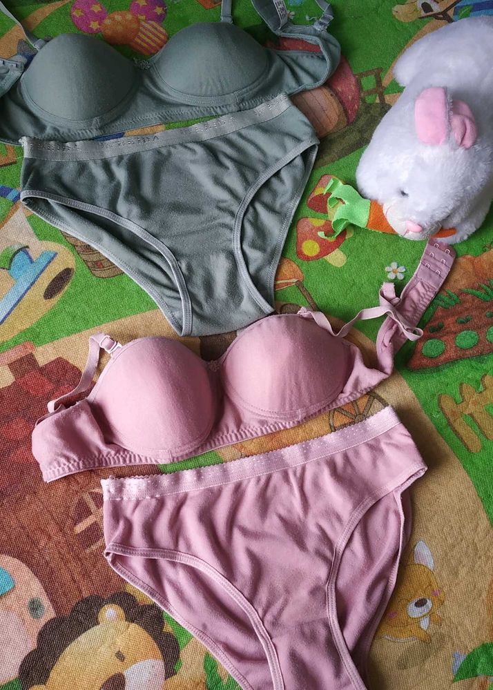 Two matching bra and panty sets