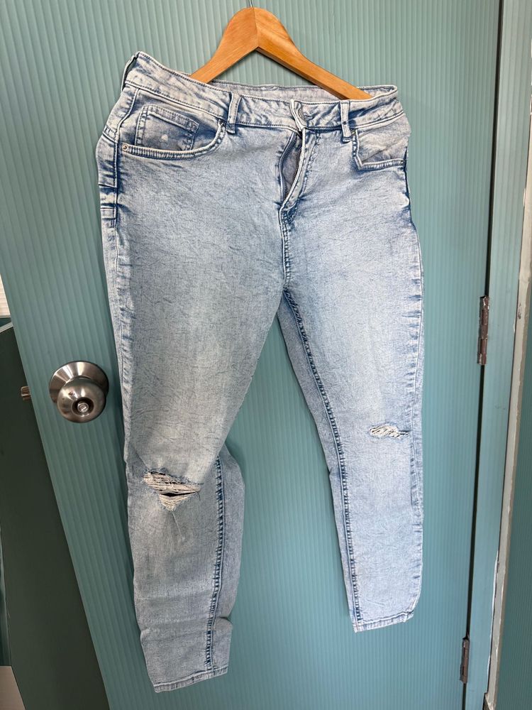 Ripped Light blue denim jeans for women