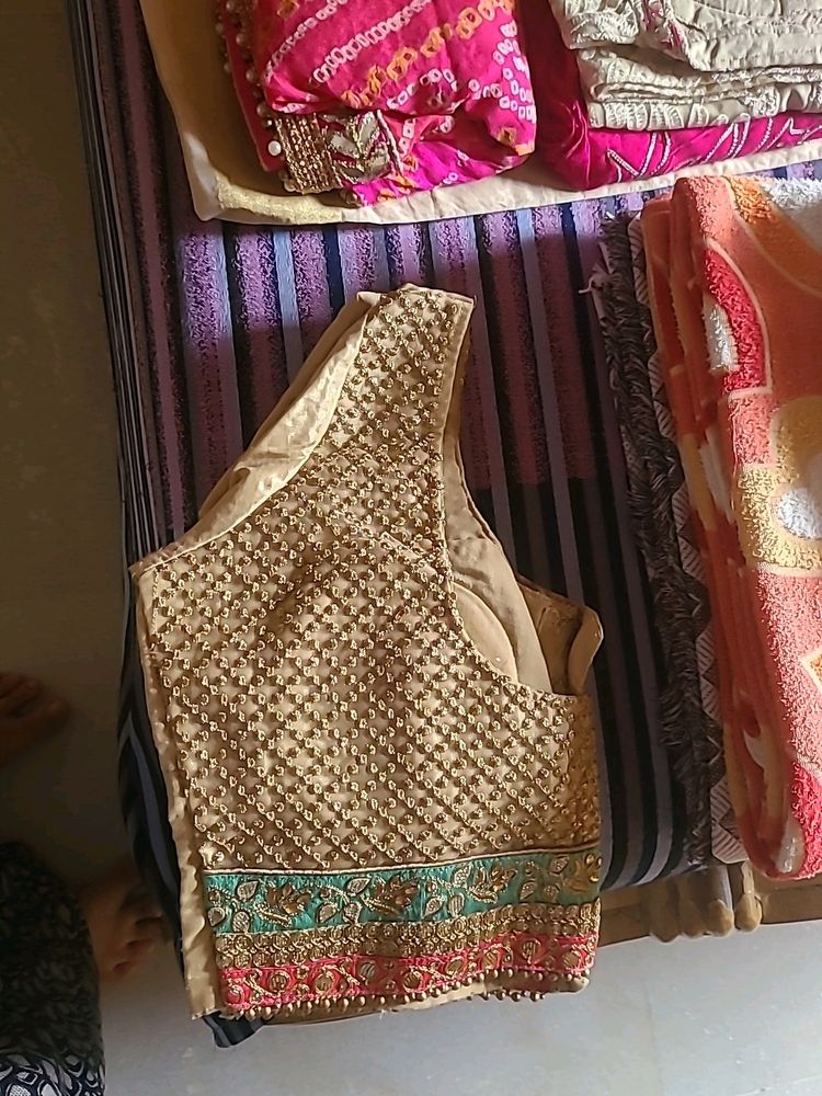 EMBELLISHED SILK LEHENGA IN PINK GREEN AND GOLDEN