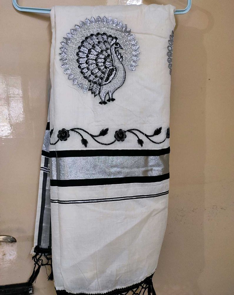 Kasuva Saree with black and silver bold border .