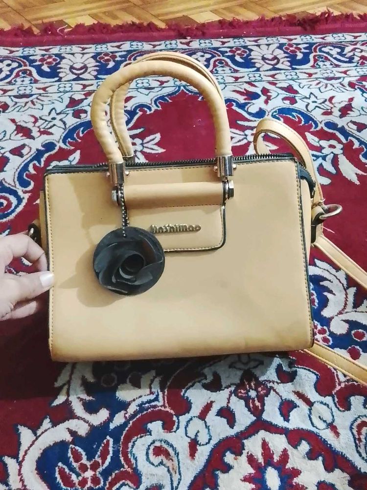 Elegant Handbag with Floral Detail