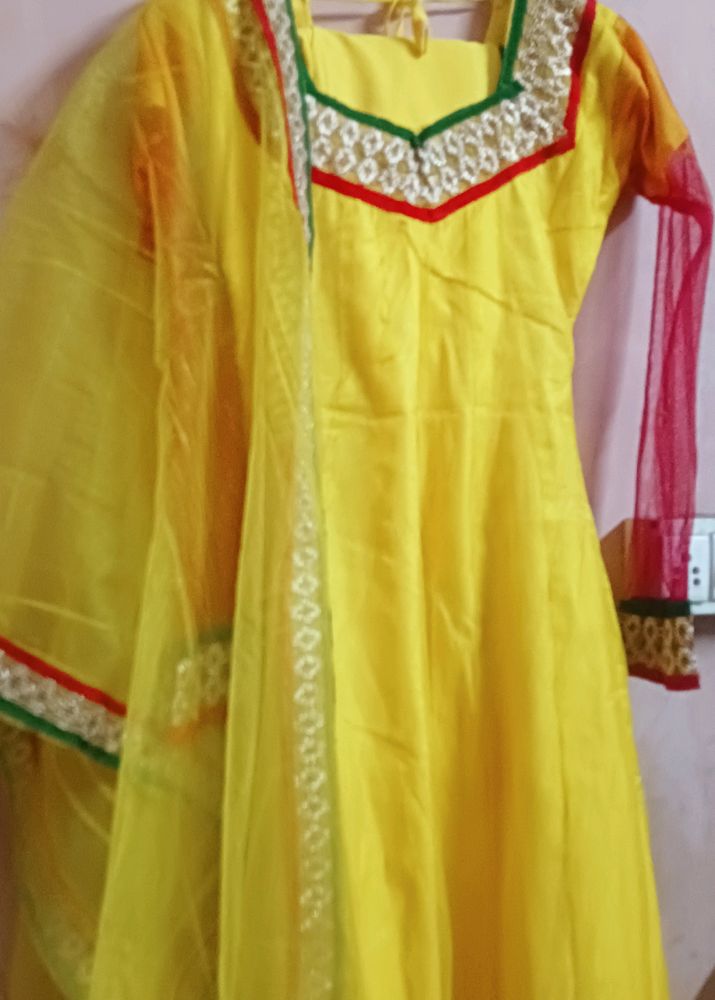 Yellow Net Frock With Churidar Pajama and dupatta