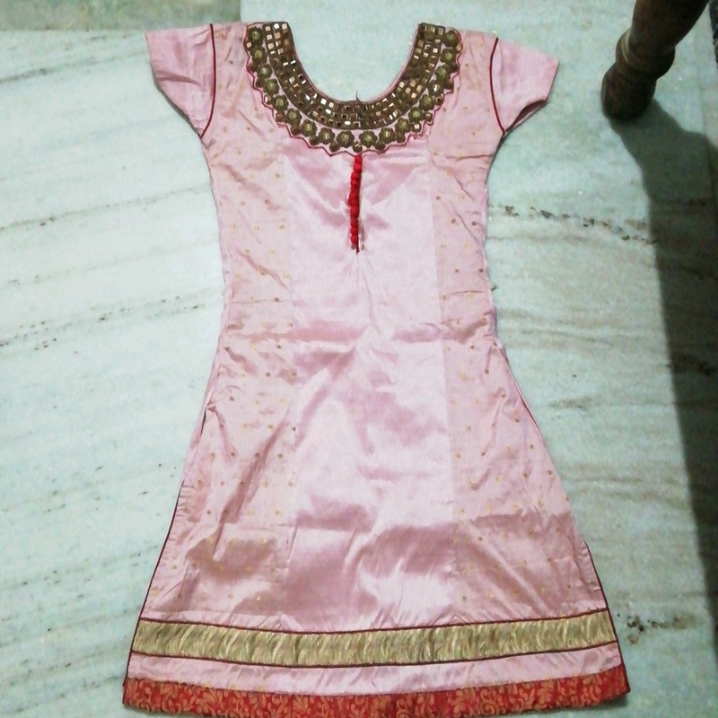 It is a patiyala dress along with duppata. one time used. no damage to patiyala Pant or duppata and the top had little that the red colour buttons has a  stitching  damage.