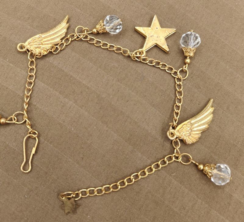 Golden Bracelet With Wings And Star Charms