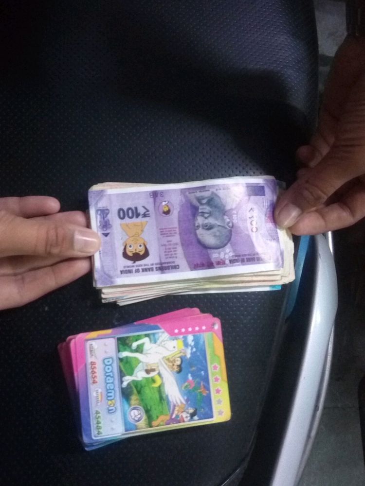 The Combo Of Playing Bank Money And Doremon Cards