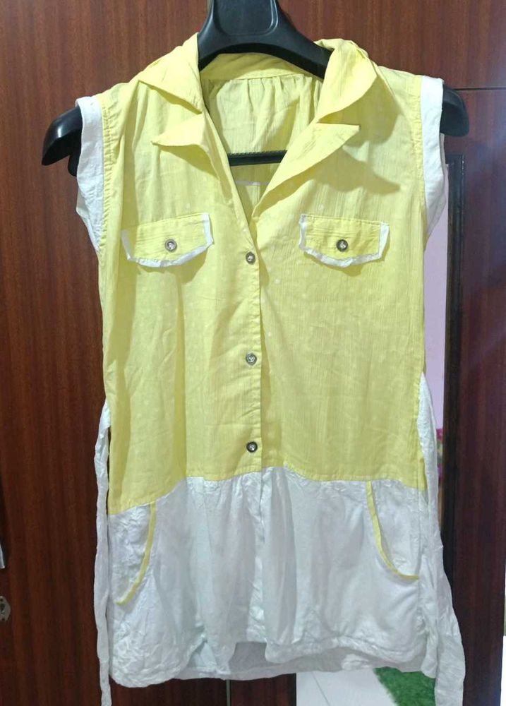 A Yellow Long Sleveless Top With 2 Pockets