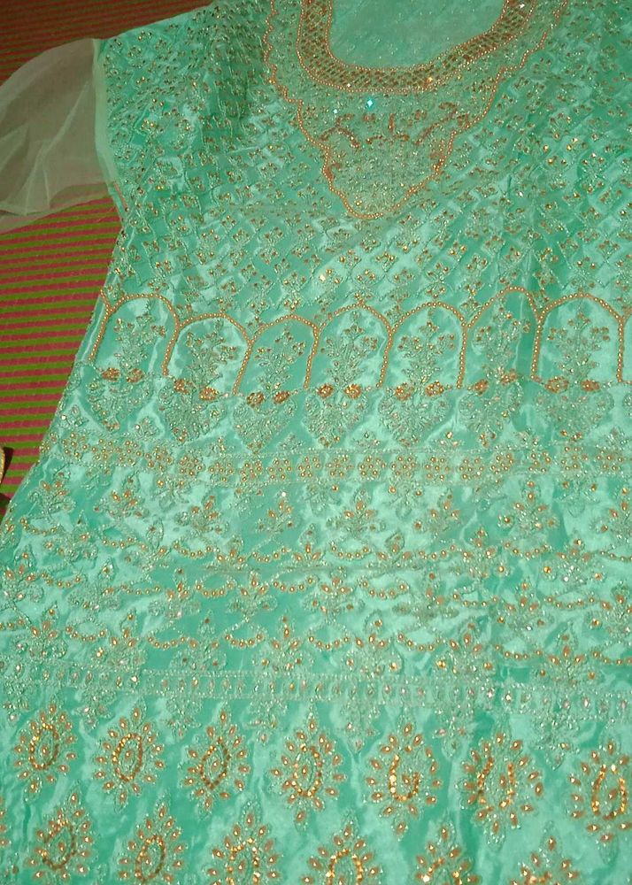 Elegant Mint Green Ethnic Semi Stitch lenhga Gown