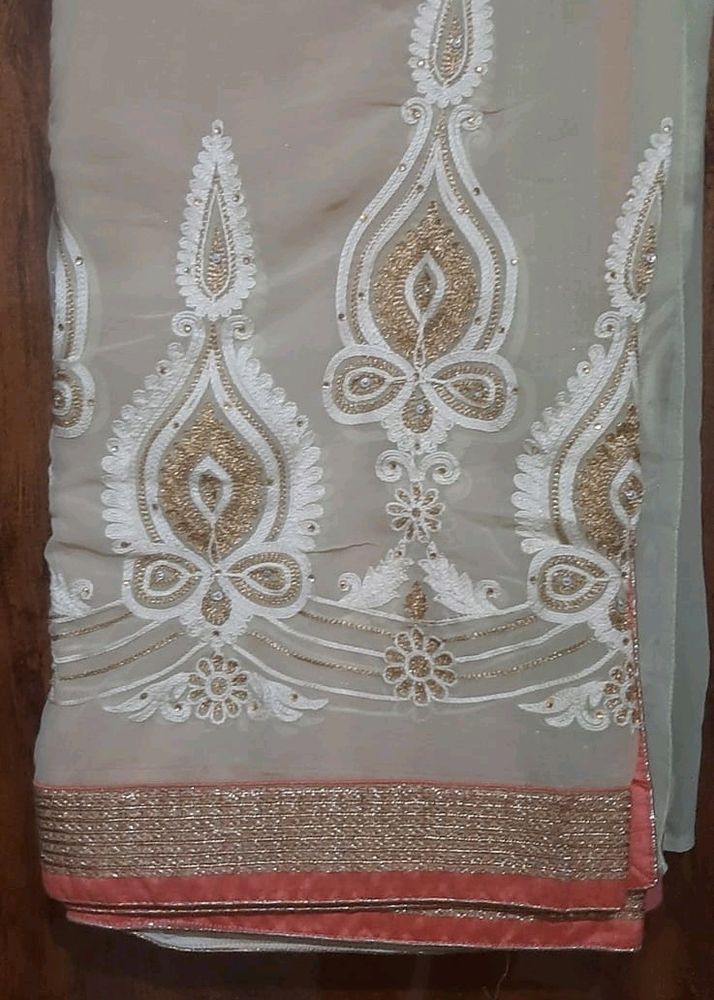 Beautiful Peachy Pink Saree with embroidery