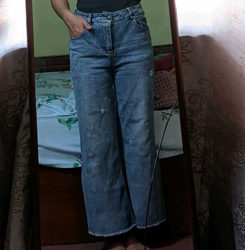 Light blue wide-leg jeans.