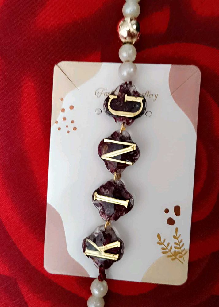 Rakhi GNIK Initial Pearl