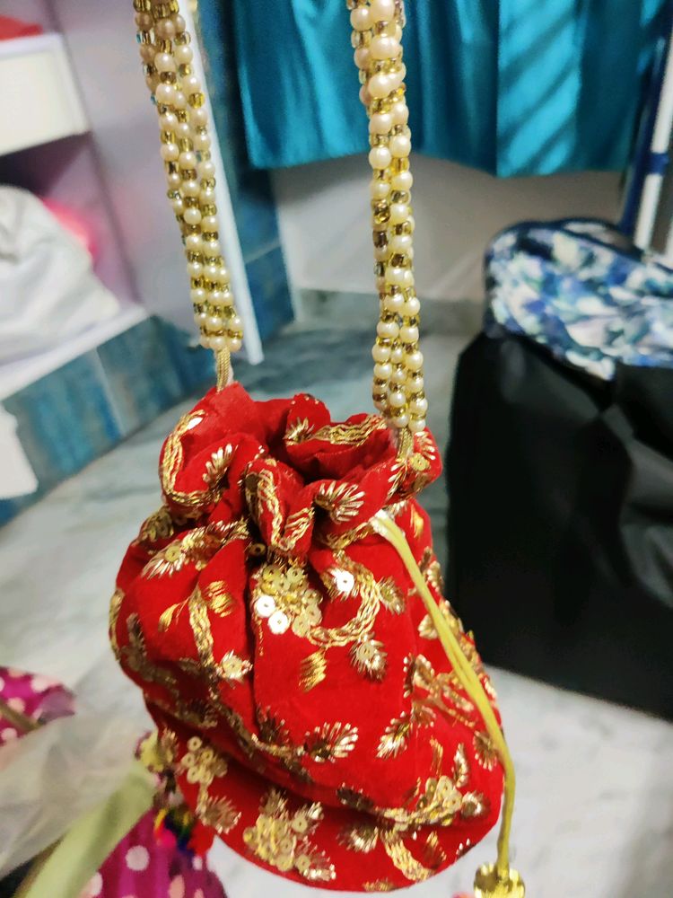 Red embroidery potli