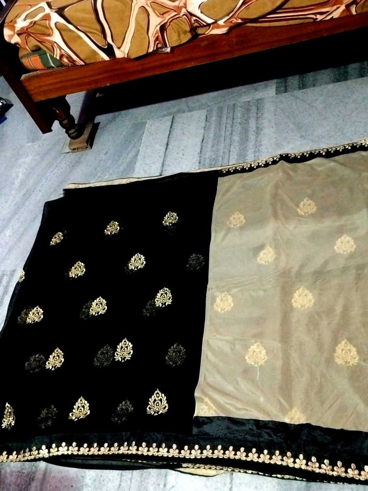 Beautiful Black And Cream Colour Georgette Saree