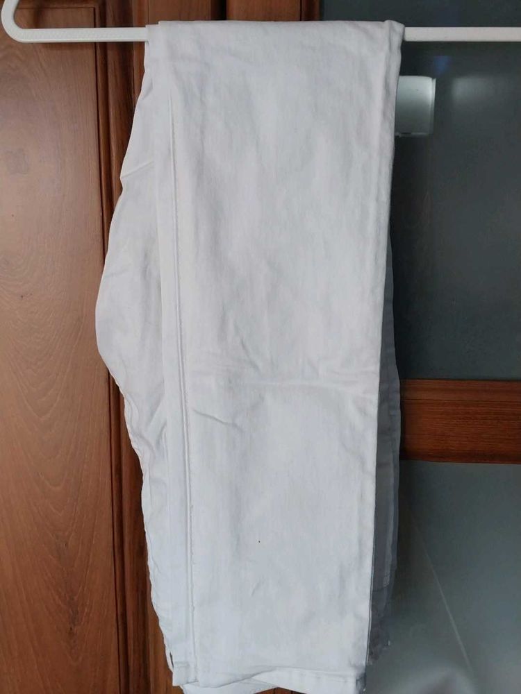 White Mid Raise Skinny Jeans
