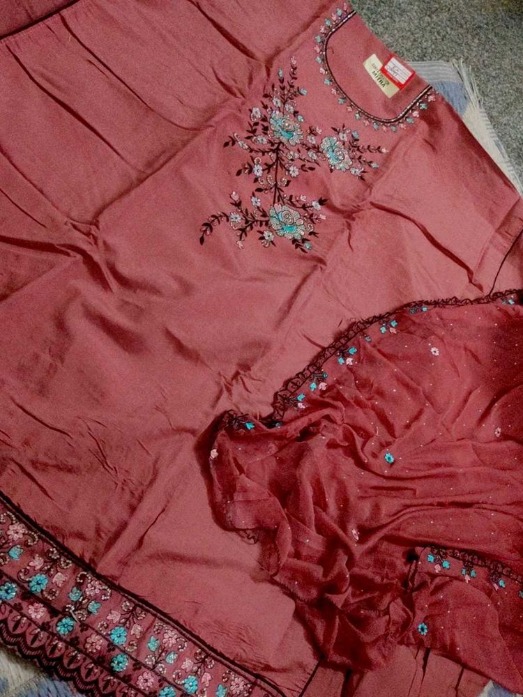 Unstitched Embroidered Dress Materials